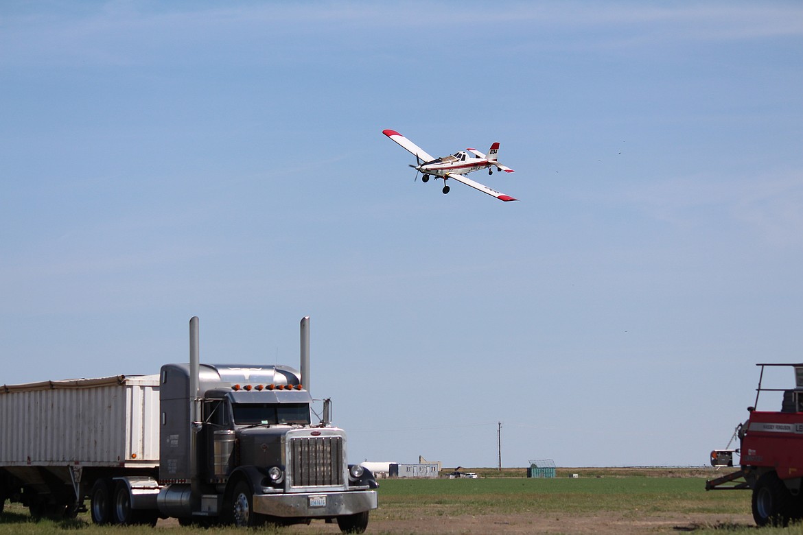 Weston Meise flies through a turn preparatory to making another pass over a farm field the air after finishing an aerial application.