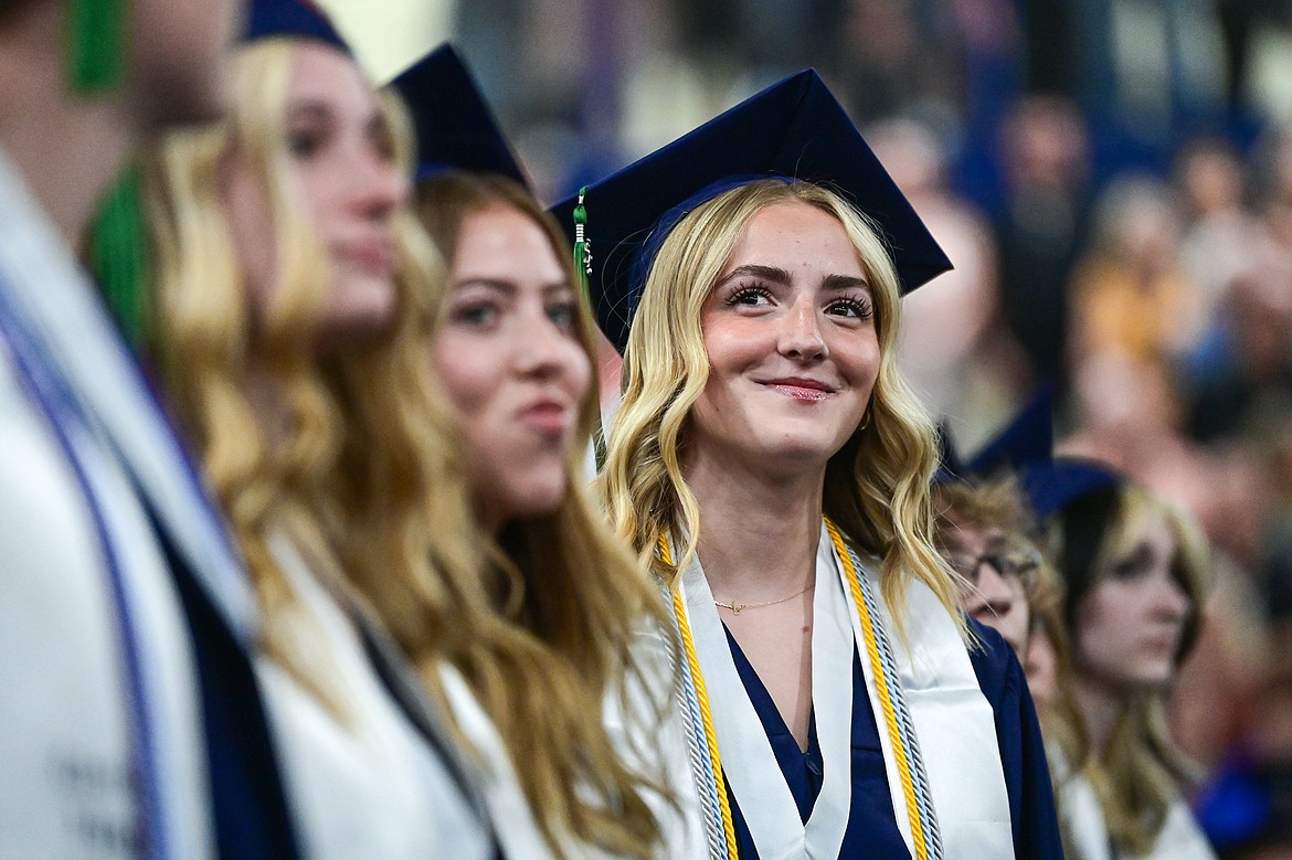 A graduate smiles to the crowd at the Glacier High School class of 2025 graduation ceremony on Saturday, May 31. (Casey Kreider/Daily Inter Lake)