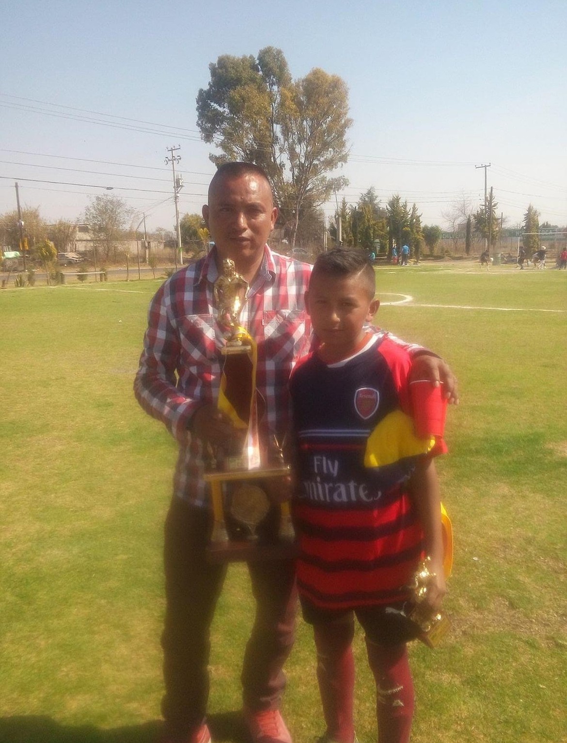Jose Cabrera, 12 at the time of this picture, poses for a photo with his dad. Cabrera first began playing soccer when he was 10 years old.