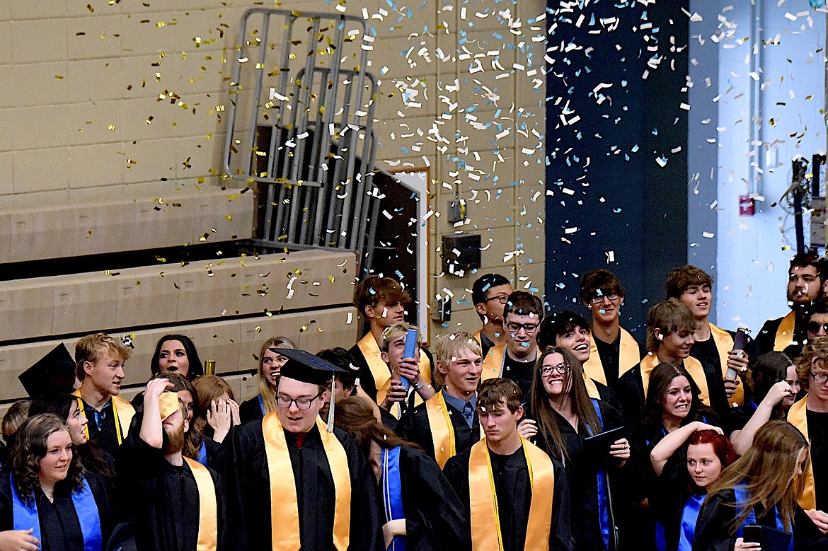 Libby High School graduates toss confetti and their mortarboard caps during graduation ceremonies Saturday, May 31, 2025, in Ralph Tate Gymnasium. (Scott Shindledecker/The Western News)