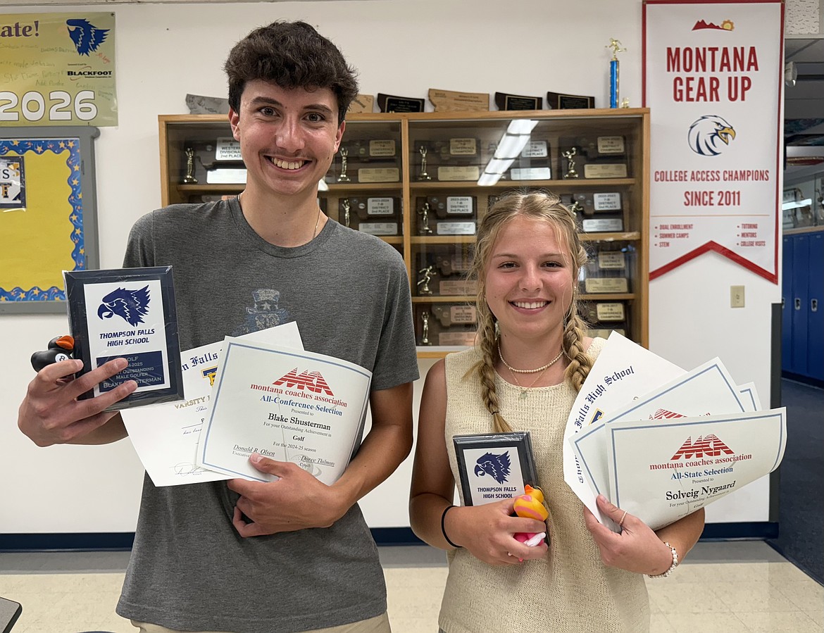 Two of Thompson Falls' all-state golf honorees Blake Shusterman (right) and Solveig Nygaard show their achievement awards during a recent ceremony in Thompson Falls. (Photo by Doree Thilmony)