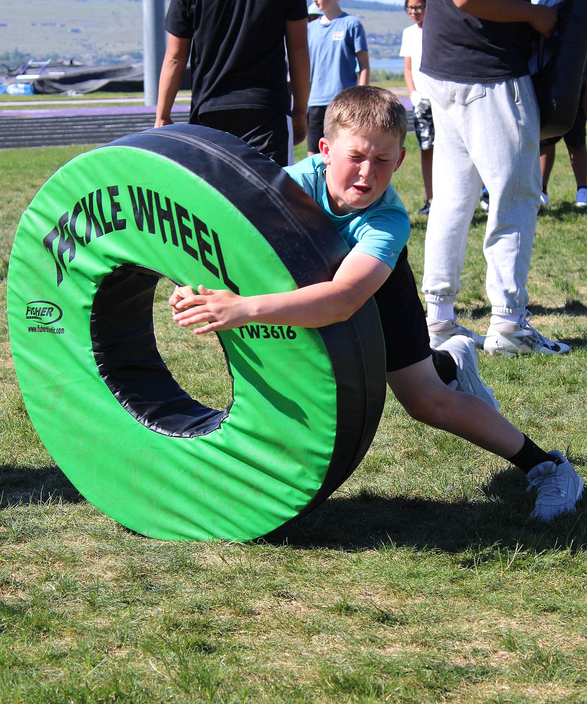 Campers got their chance to get physical learning hitting form on the tackle wheel with cheers from fellow campers and coaches. (Kaleb Unger/Leader)