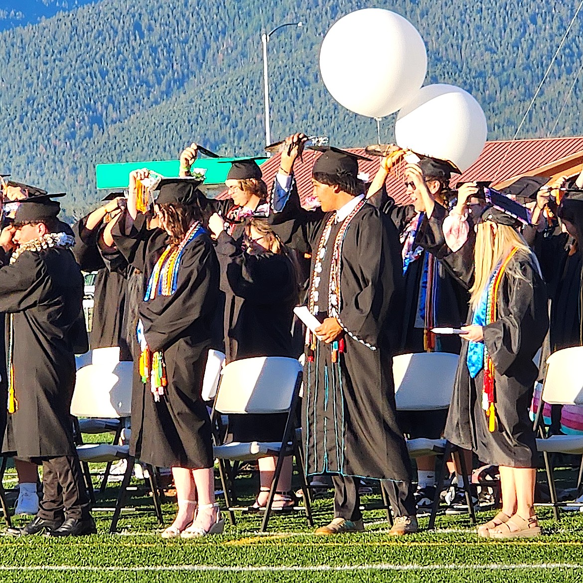 Ronan's Class of 2025 moves the tassels on their mortarboards from right to left in unison to symbolize their graduation. (Berl Tiskus/Leader)