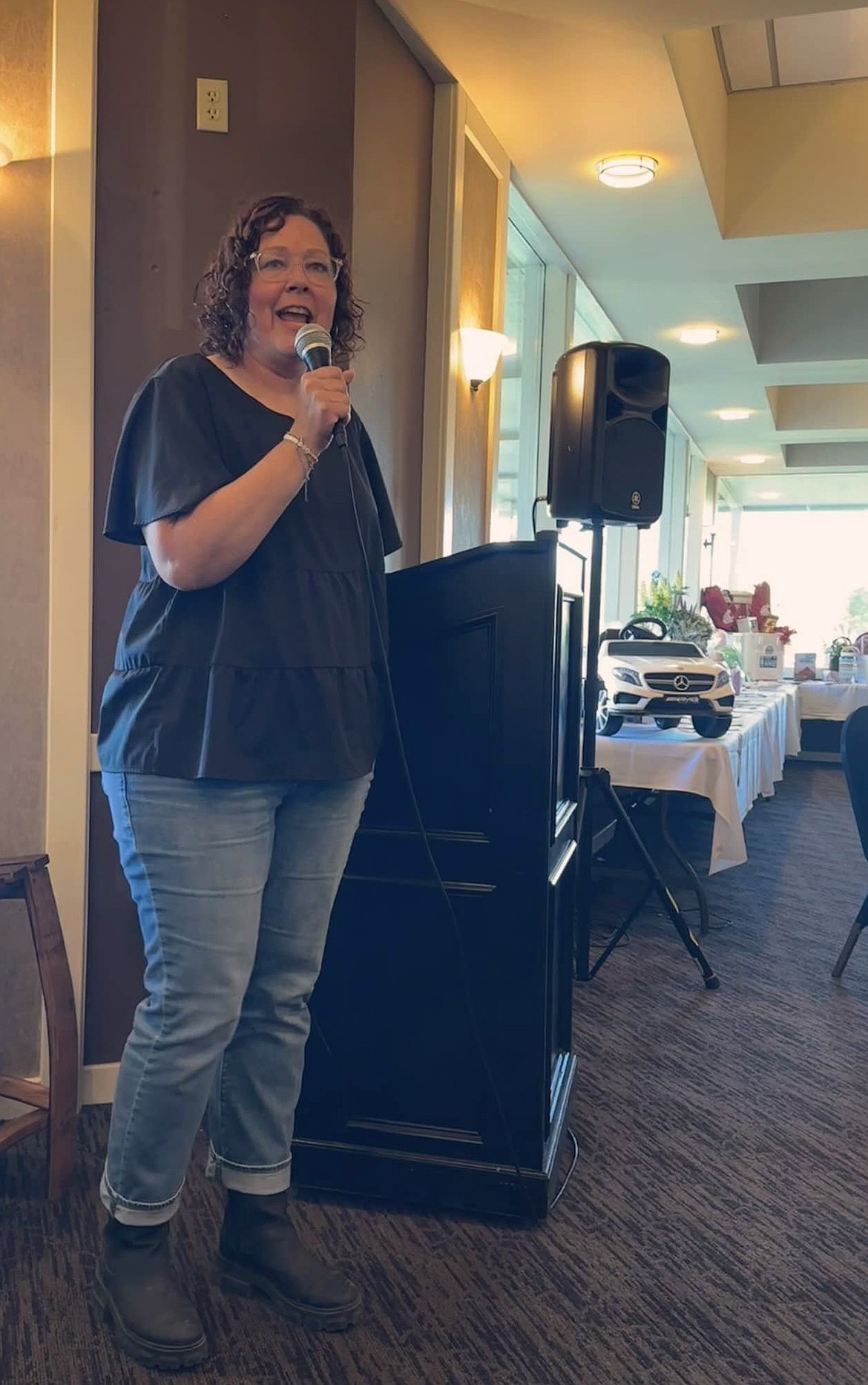 Holly Thompson, the recipient of last year’s Live Your Dream award, tells the crowd at the Soroptimist auction about how the scholarship will help her finish her degree and achieve her career goals.