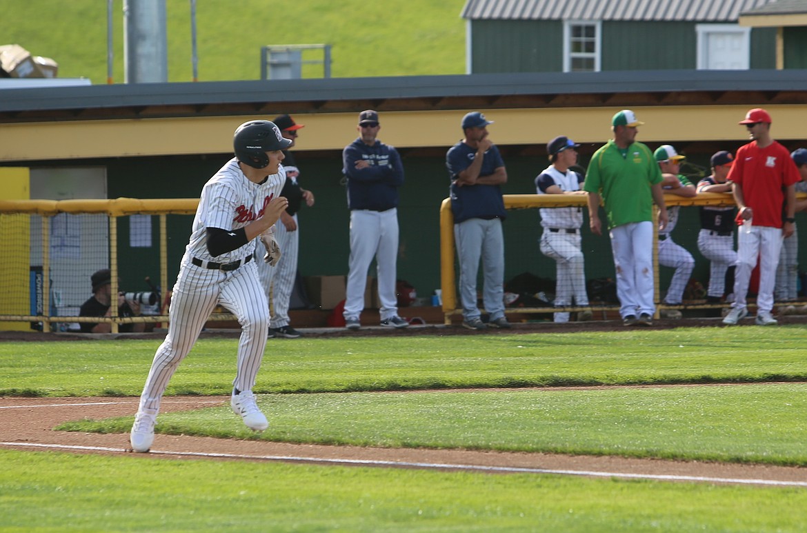 Jordan Montemayor running for first base after hitting the ball into the outfield. Montemayor sported another version of the Huskies uniform than his teammate Salazar.