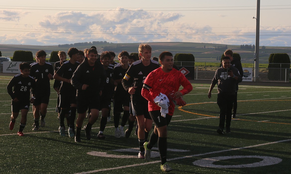 The Knights running to greet fans who ran on the field to celebrate winning their second straight district championship. Head coach Jens Jensen has no doubts his team will be right back in the state tournament next year.