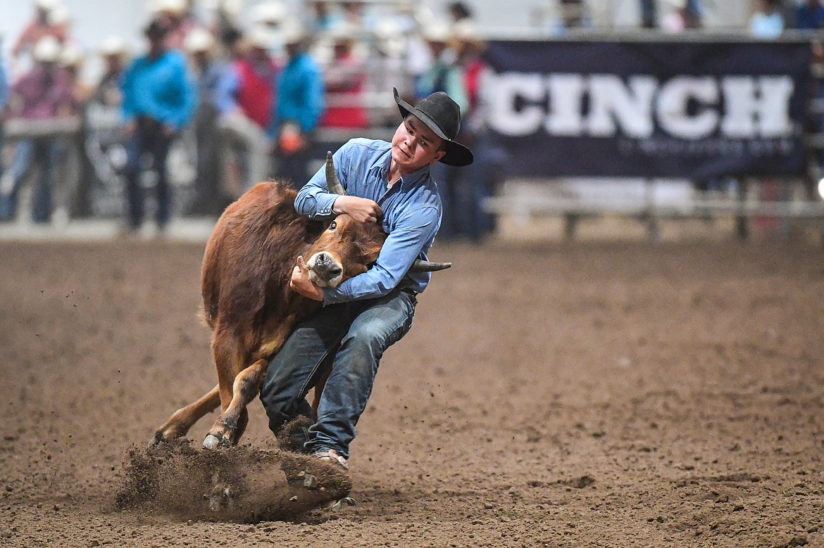 Tike Erickson, from Hobson, competes in the steer wrestling event at the Montana High School Rodeo Association Finals at Majestic Valley Arena on Thursday, June 5. (Casey Kreider/Daily Inter Lake)