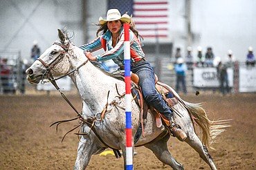 Ruby Ray, from Whitefish, weaves her horse through the pattern in pole bending at the Montana High School Rodeo Association Finals at Majestic Valley Arena on Thursday, June 5. (Casey Kreider/Daily Inter Lake)