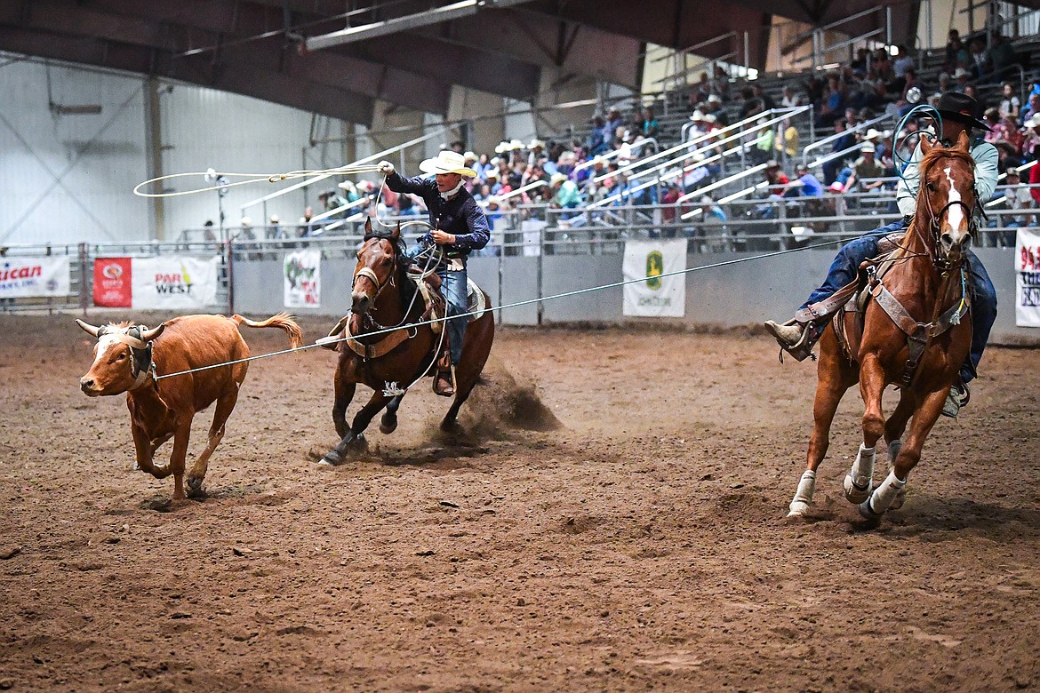 Tryan Knight and Cooper Fisher compete in team roping at the Montana High School Rodeo Association Finals at Majestic Valley Arena on Thursday, June 5. (Casey Kreider/Daily Inter Lake)