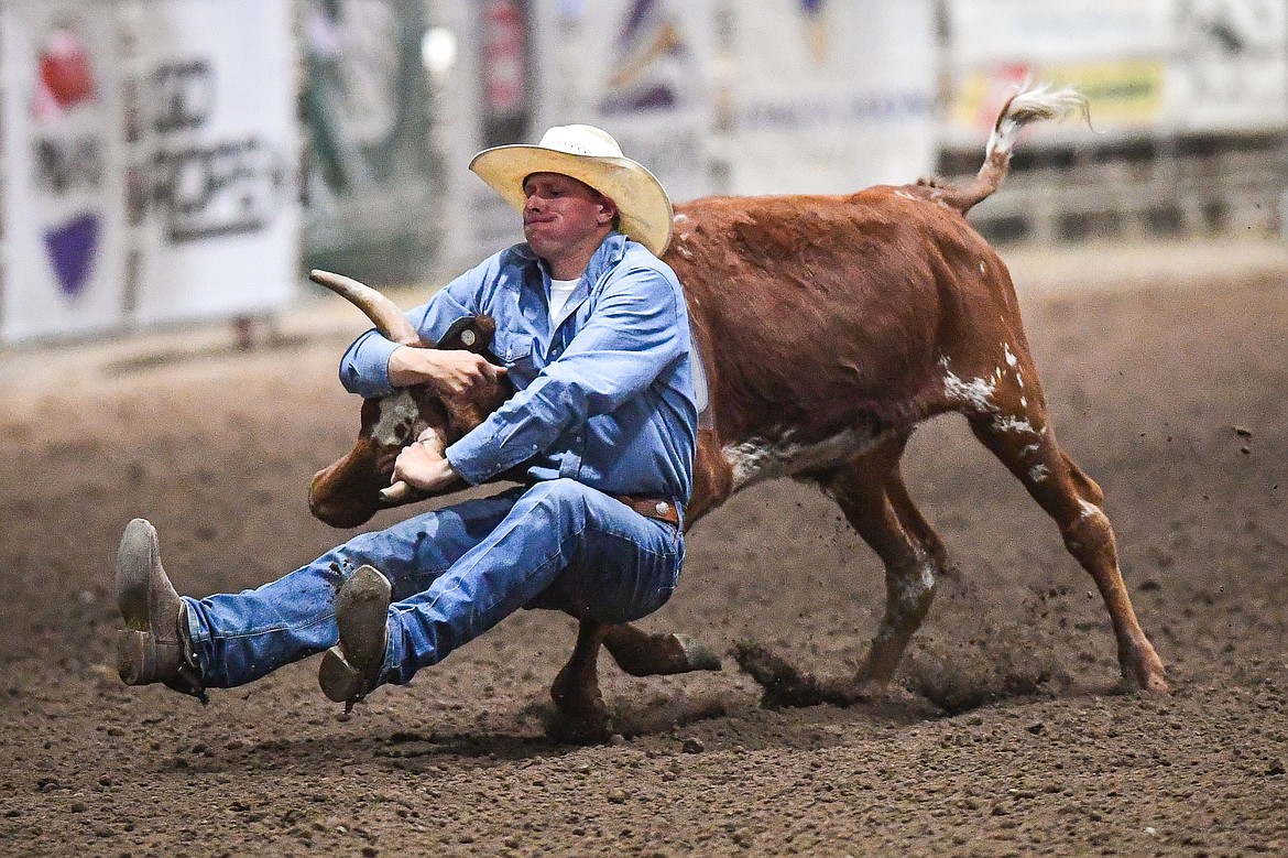 Teagen Arnold, from Conrad, competes in the steer wrestling event at the Montana High School Rodeo Association Finals at Majestic Valley Arena on Thursday, June 5. (Casey Kreider/Daily Inter Lake)