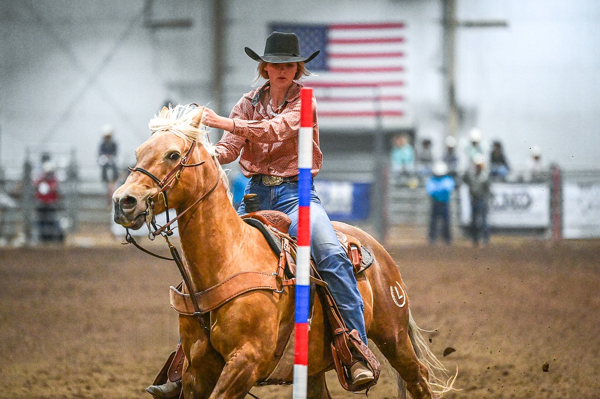 Evelyn Bennett, from Kalispell, weaves her horse through the pattern in pole bending at the Montana High School Rodeo Association Finals at Majestic Valley Arena on Thursday, June 5. (Casey Kreider/Daily Inter Lake)