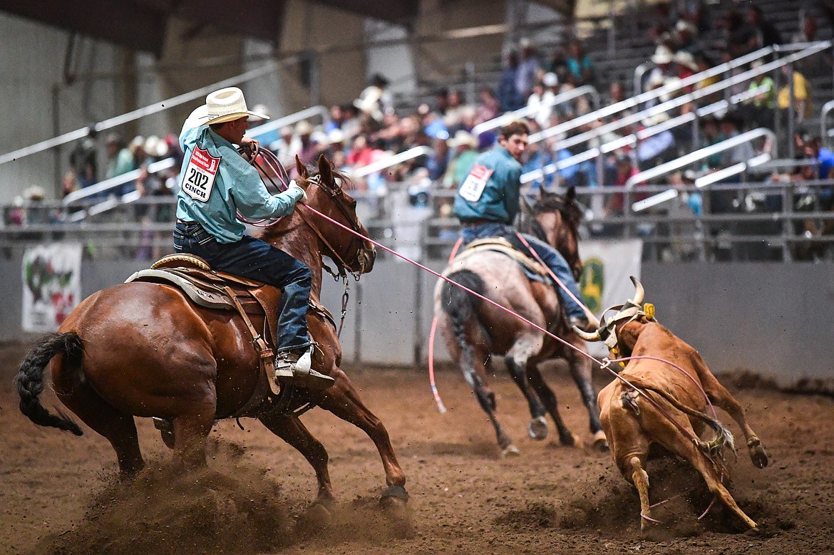 Jace DeSaye and Wiley Dempewolf compete in team roping at the Montana High School Rodeo Association Finals at Majestic Valley Arena on Thursday, June 5. (Casey Kreider/Daily Inter Lake)