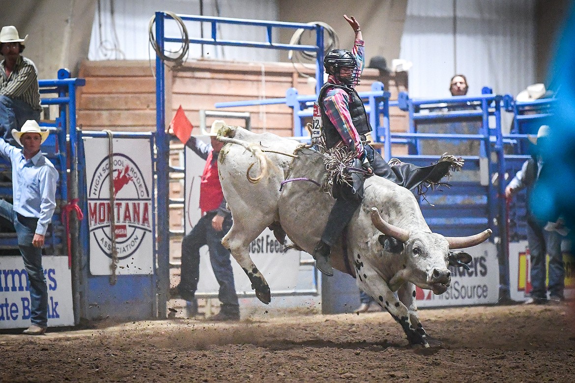 Octavius Christianson, from Columbia Falls, competes in bull riding at the Montana High School Rodeo Association Finals at Majestic Valley Arena on Thursday, June 5. (Casey Kreider/Daily Inter Lake)