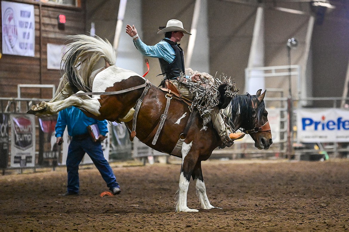 Taylor Koch, from Roberts, competes in the saddle bronc riding event at the Montana High School Rodeo Association Finals at Majestic Valley Arena on Thursday, June 5. (Casey Kreider/Daily Inter Lake)
