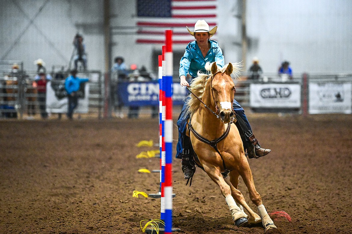Mackenzie Martell, from Three Forks, weaves her horse through the pattern in pole bending at the Montana High School Rodeo Association Finals at Majestic Valley Arena on Thursday, June 5. (Casey Kreider/Daily Inter Lake)