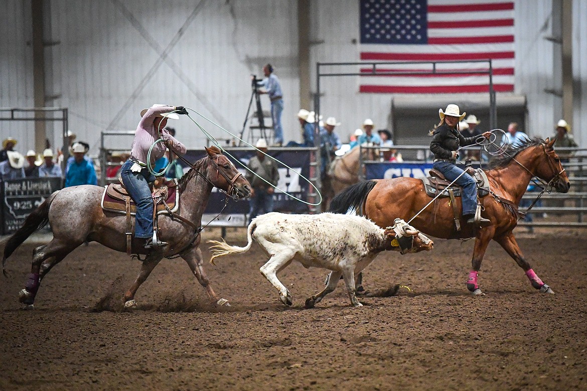 Lanee Rose Cote and Rylee Webb compete in team roping at the Montana High School Rodeo Association Finals at Majestic Valley Arena on Thursday, June 5. (Casey Kreider/Daily Inter Lake)