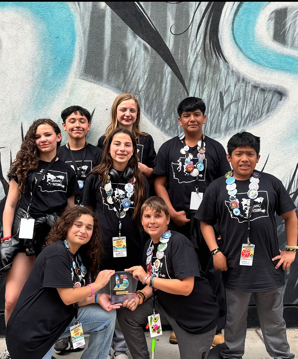 The Royal Middle School Oceanic Outlaws display their trophy for the On the Spot challenge. Back, from left: Martin Alcala, Archer Guyton, Jose Villanueva. Middle: Lilly Piper, Eva Villa, Manny Luis-Reyes. Front: Maria Gallegos, Caleb Freeman.