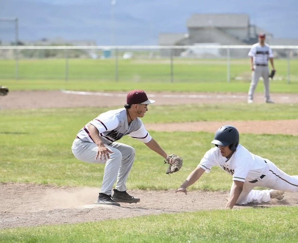 Wahluke Warriors’ third baseman tagging his opponent out in one of their games during the season.