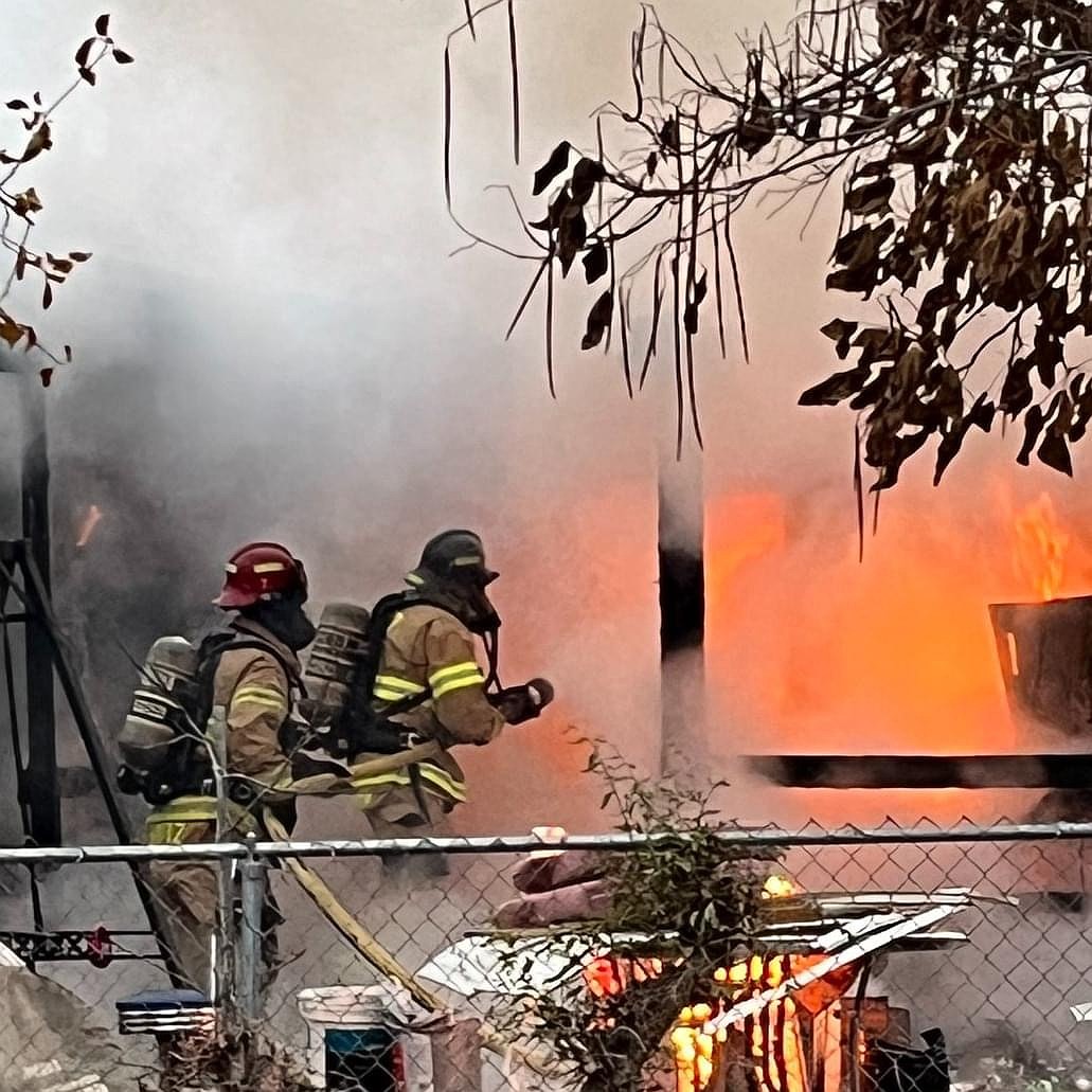 Moses Lake Fire Department personnel at a fire scene in December 2024. Whether to keep the MLFD as it is or convert it to some kind of fire district will be the subject of a feasibility study this year.