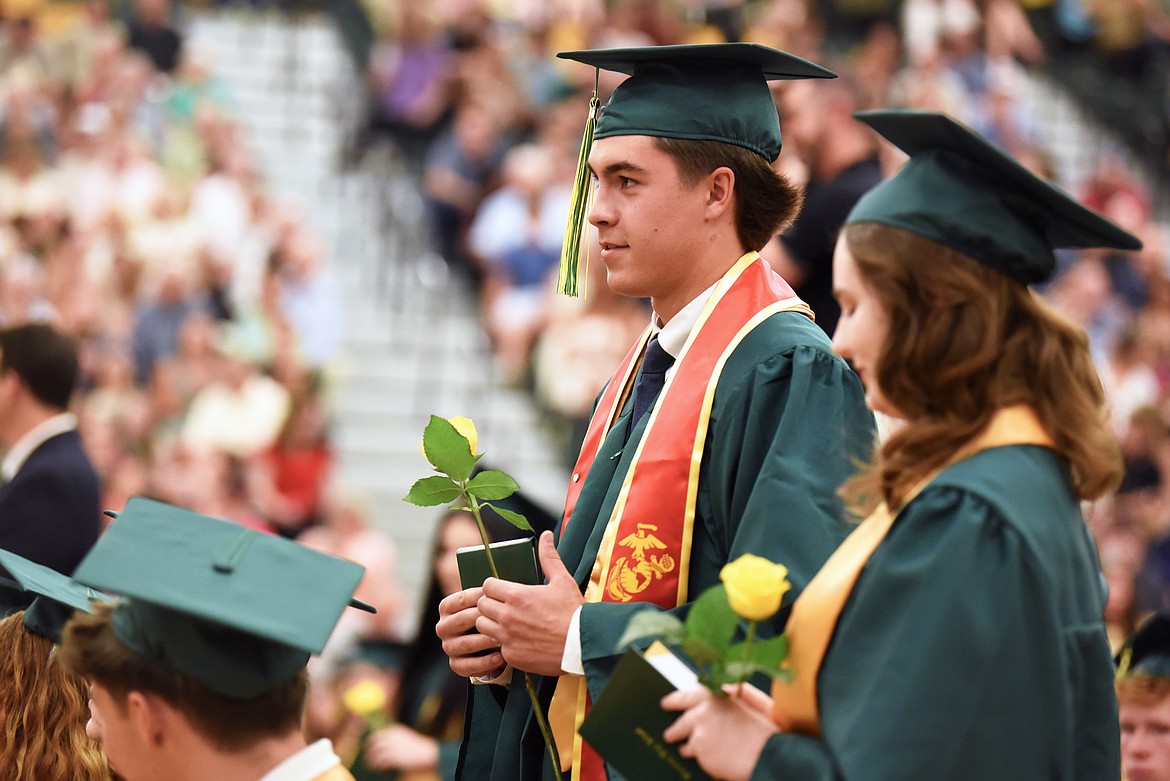 Graduates receive roses on Saturday. (Kelsey Evans/Whitefish Pilot)