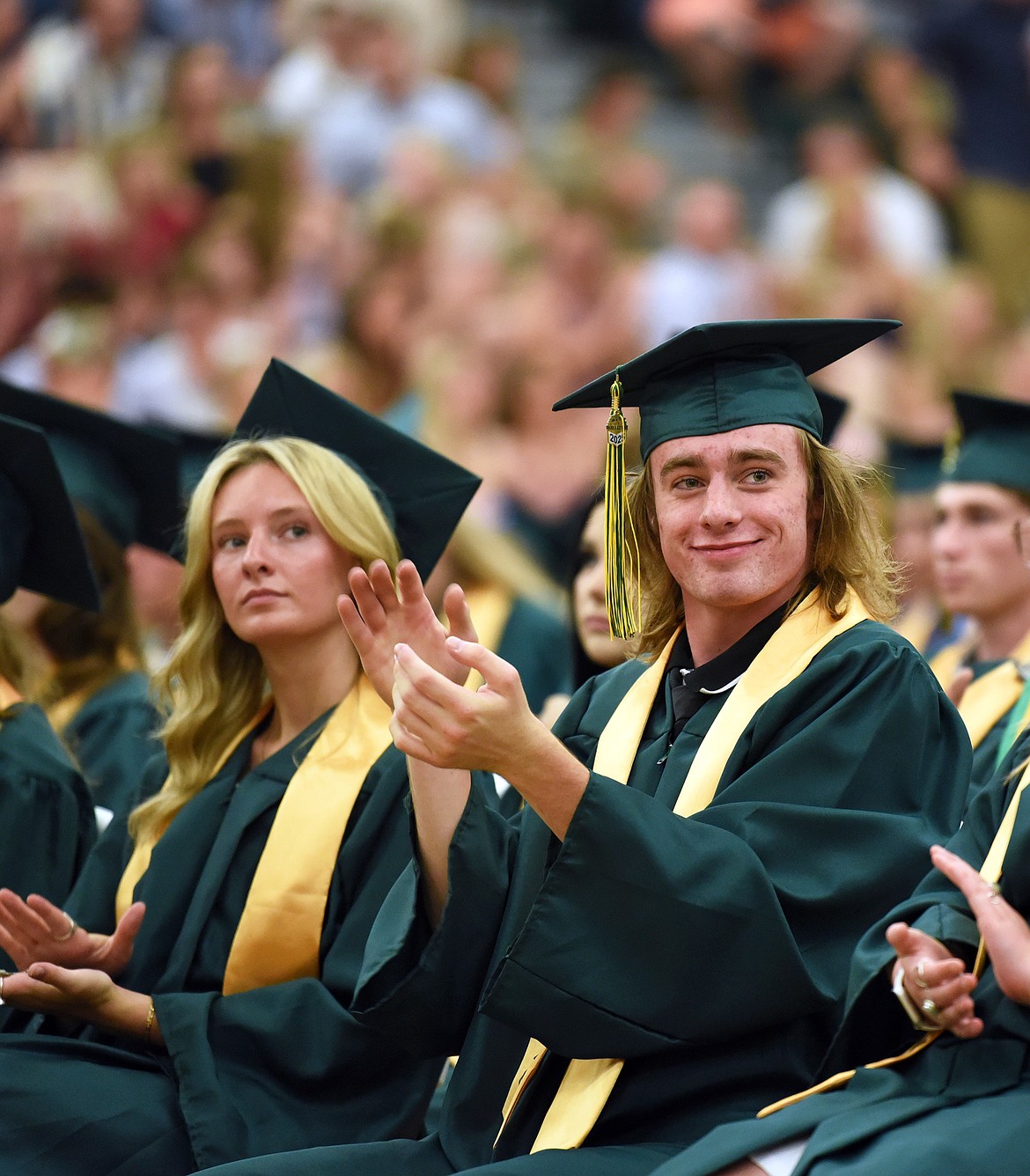 Whitefish High School graduates applaud their peers at graduation Saturday. (Kelsey Evans/Whitefish PIlot)