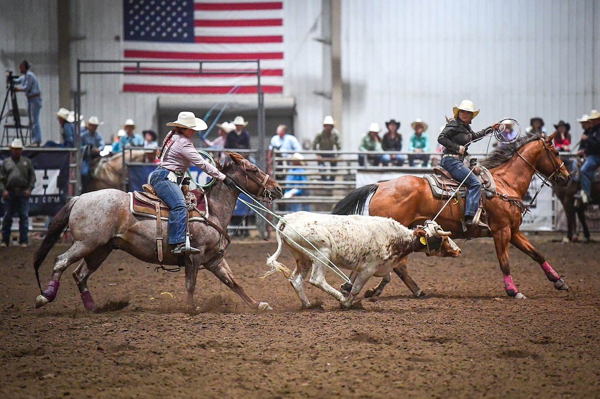 Eureka's Lanee Rose Cote, left, and Arlee's Rylee Webb compete in team roping at the Montana High School Rodeo Association Finals at Majestic Valley Arena on Thursday, June 5, 2025. (Casey Kreider/Daily Inter Lake)