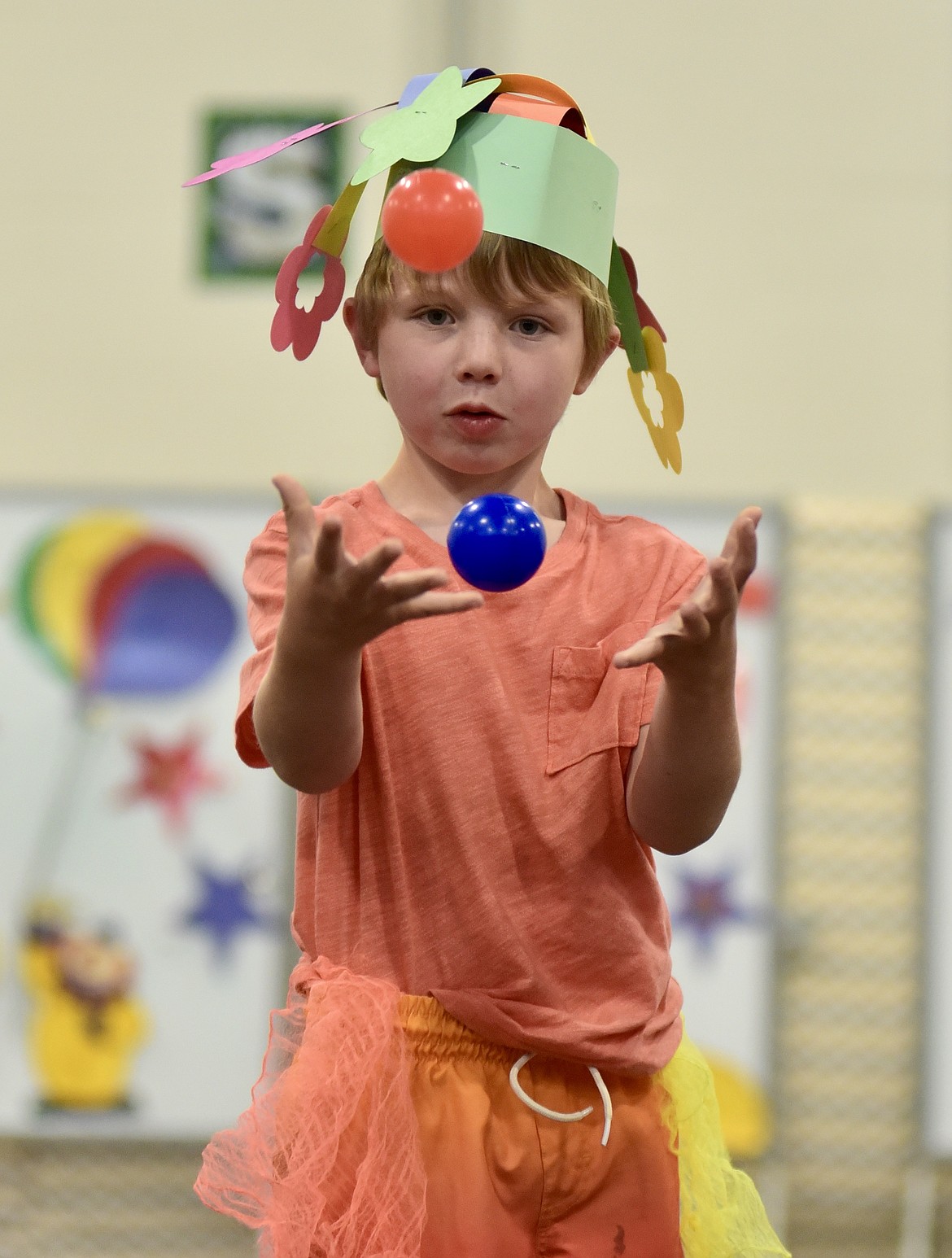Robbins Marlowe-Schrader keeps eyes on his juggling balls at the Muldown Elementary kindergarten circus on Monday, June 9, 2025. (Matt Baldwin/Whitefish Pilot)