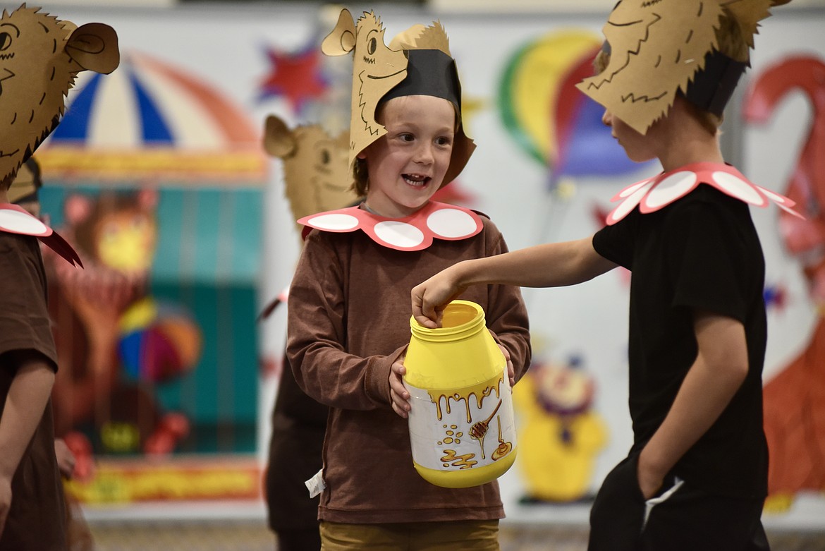 Bears get a dip from the honey pot during the Muldown Elementary kindergarten circus on Monday, June 9, 2025. (Matt Baldwin/Whitefish Pilot)