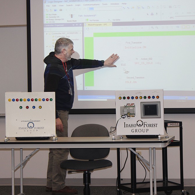 Jeremy Fromm, with Idaho Forest Group, teaches a class in programmable logic controllers at the North Idaho College Workforce Training Center. Students learn skills in automation and control systems, which are essential to modern manufacturing processes.