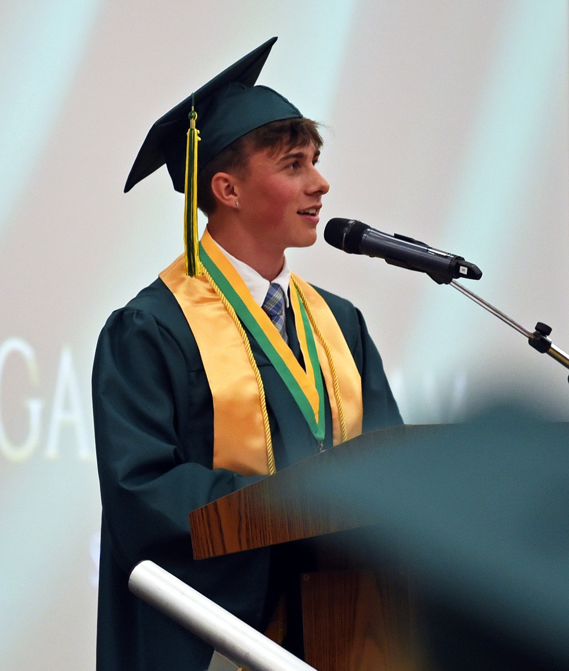 Logan Bingham gives opening remarks at graduation Saturday. (Kelsey Evans/Whitefish Pilot)