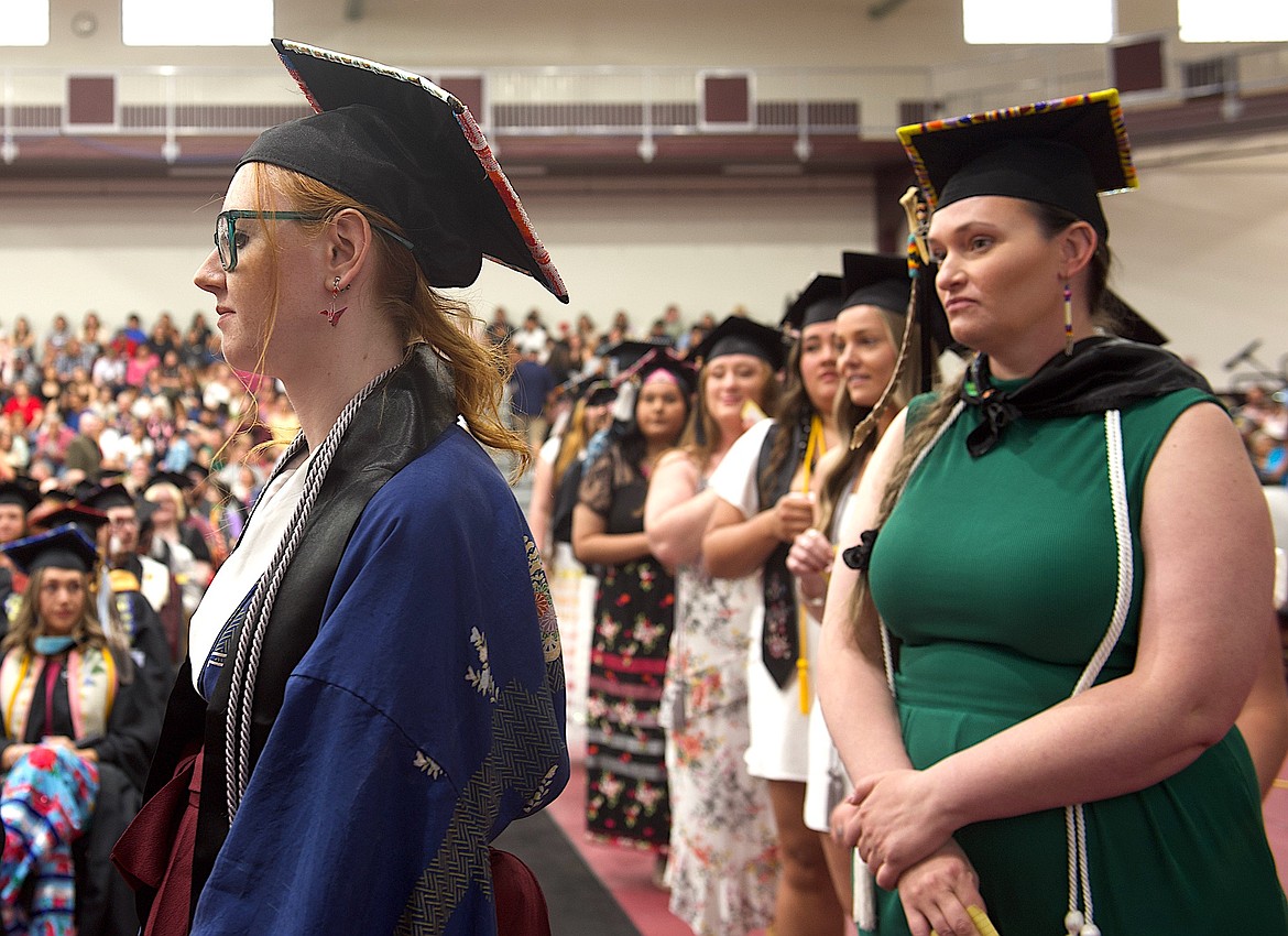 Salish Kootenai College nursing graduates line up to receive bachelor's diplomas during Saturday's graduation. (Kristi Niemeyer/Leader)