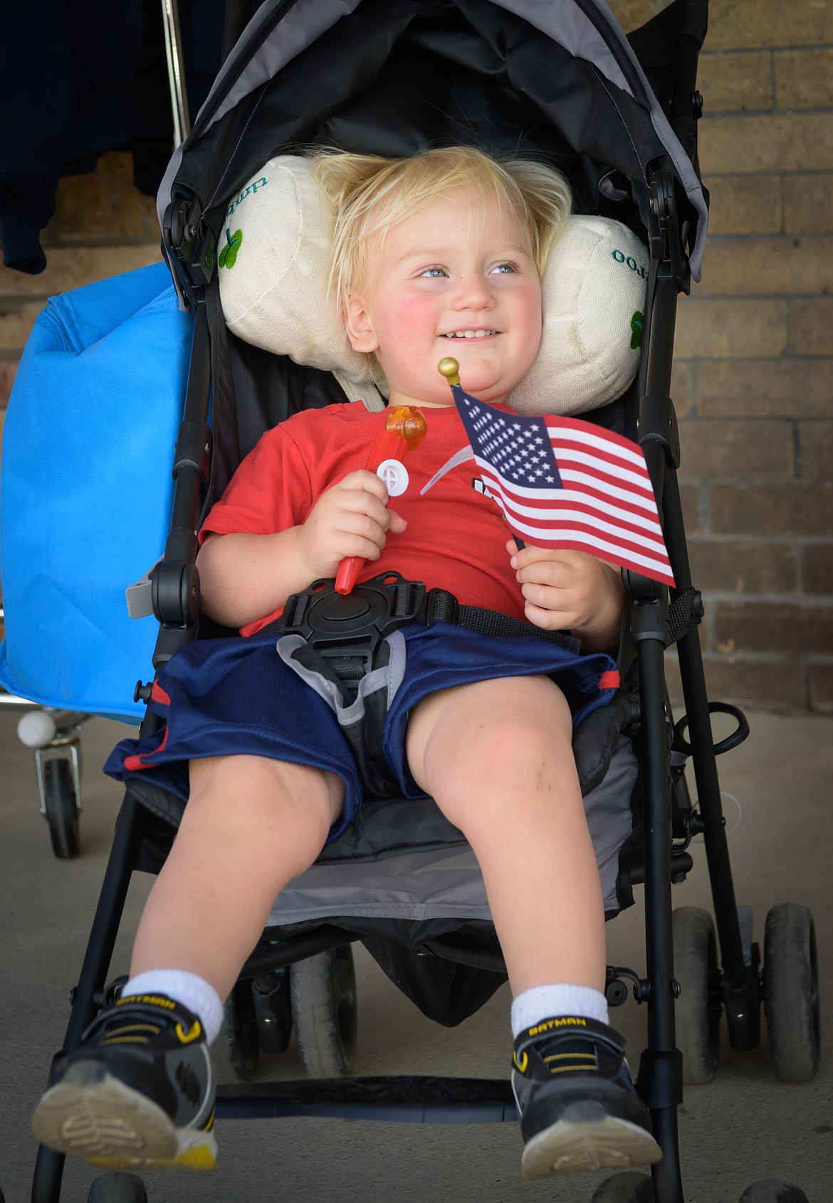 One-year-old Plains resident Psylas Khachaturov takes a more laid-back approach during the Plains Day Parade. (Tracy Scott/Valley Press)