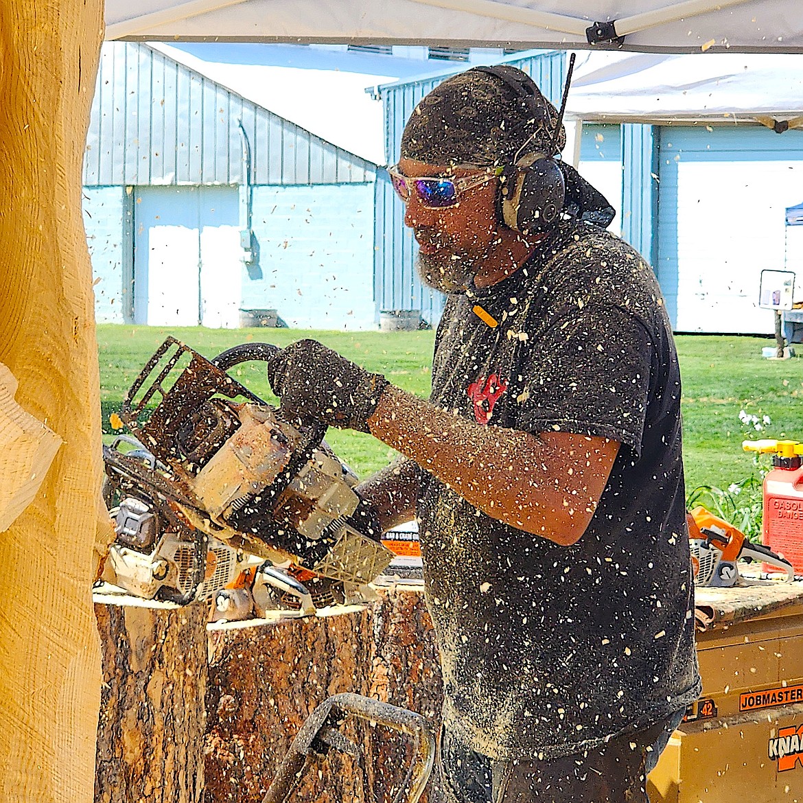 Anthony Robinson makes the sawdust fly at the Chain Saw Carvers Rendezvous in Ronan. (Berl Tiskus/Leader)