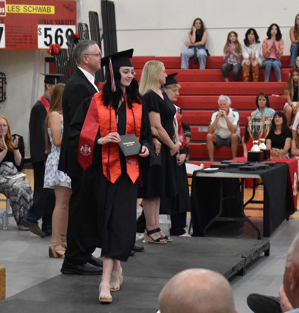 A newly-minted Lind-Ritzville graduate shows her diploma at commencement Saturday.