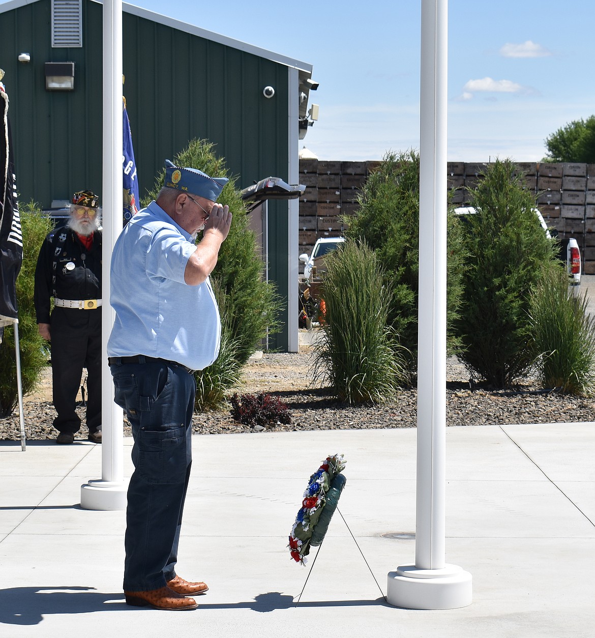 American Legion Sergeant at Arms David Jordan salutes the wreath at the base of the flagpole at Quincy Cemetery on Memorial Day, May 26.