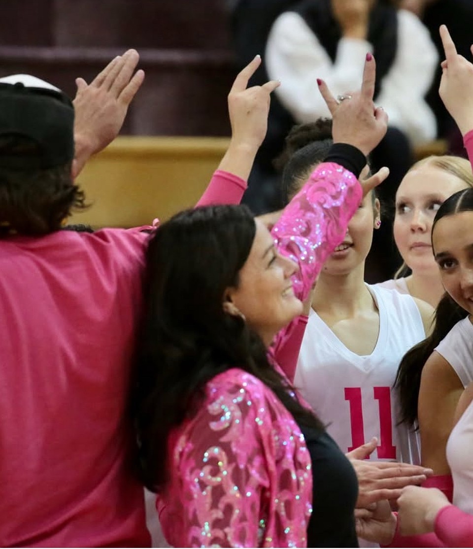 Krystal Trammell breaks down a huddle with her players before a game. Trammell said her players played with something to prove this season in the wake of the 2024 levy failure.