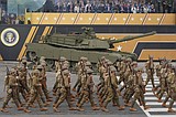 Military parade barrels through nation's capital with tanks, troops and 21-gun salute