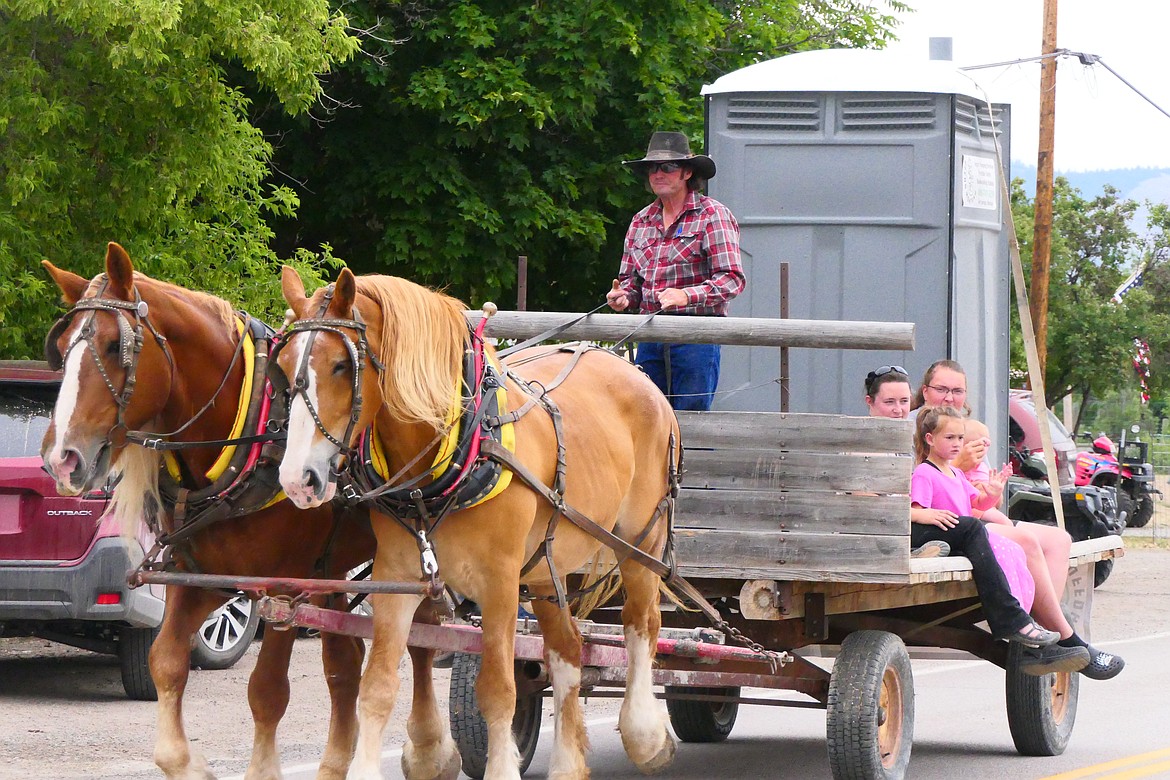 Horse and "honey bucket"? A portable outhouse is pulled by a pair of draft horses during the Homesteader Days parade Sunday in Hot Springs. (Chuck Bandel/VP-MI)