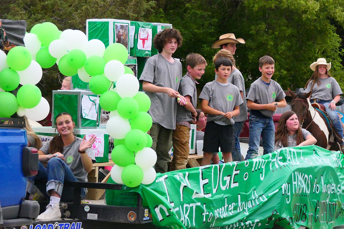 Members of the Hot Springs 4-H club ride on a float during the Homesteader Days parade this past Sunday in Hot Springs. (Chuck Bandel/VP-MI)
