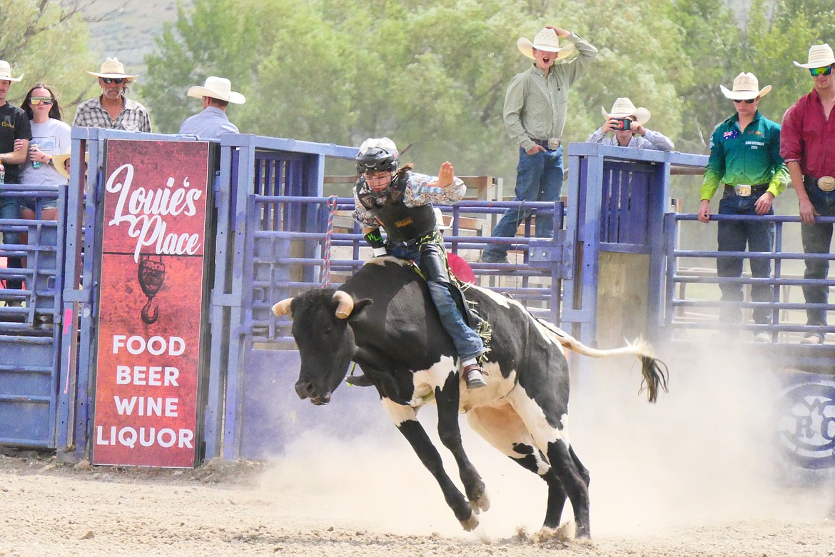 A steer goes airborne with a cowboy in the saddle during this past weekend's Homesteader Days Rodeo in Hot Springs.  (Chuck Bandel/VP-MI)