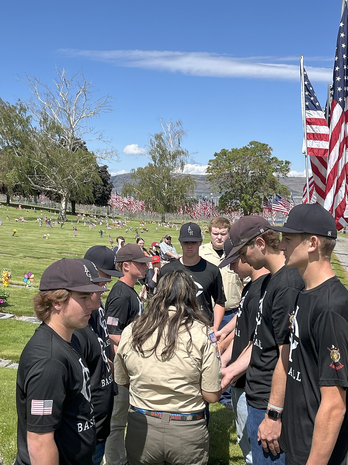 The ACH Legion baseball team assists with a flag raising event earlier this summer. Coach Mike Correia said it's important that the players stay involved in events with the American Legion, so they remember what they stand for.