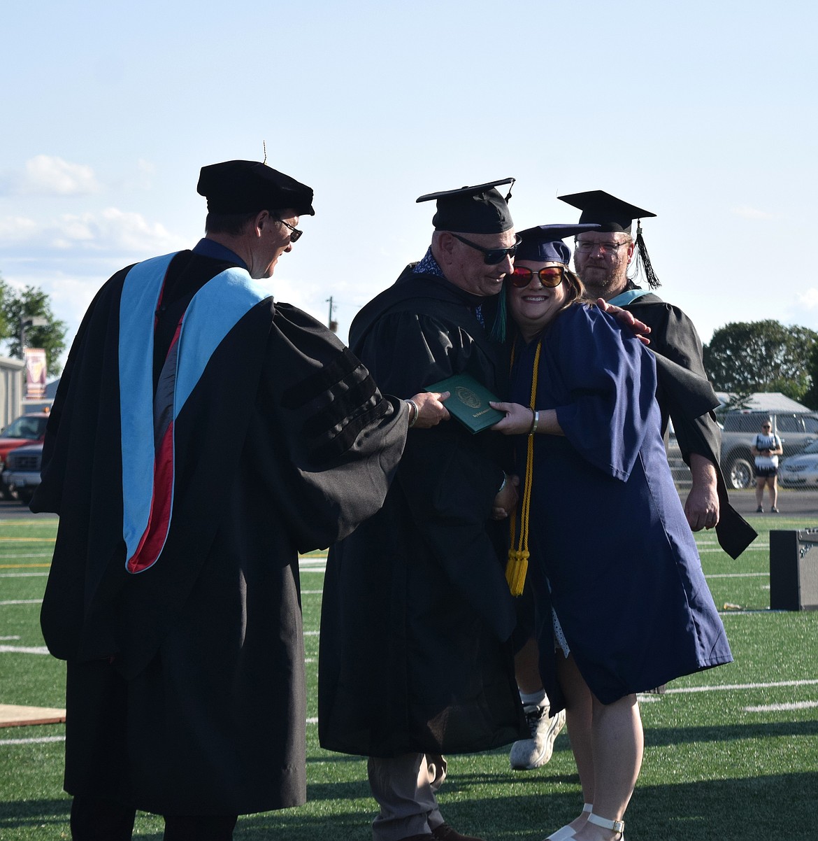 One Big Bend Community College graduate hugs her teacher during graduation Friday.