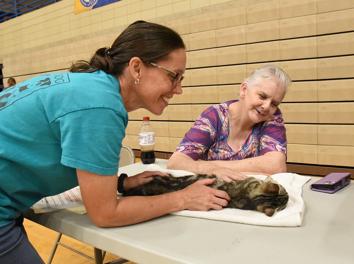 Libby residents Erin Taylor, left, and Kathy Rodgers help "Tigger" during recovery after surgery at Spay Montana's Spay/Neuter Clinic June 7, 2025, in Libby. (Scott Shindledecker/The Western News)