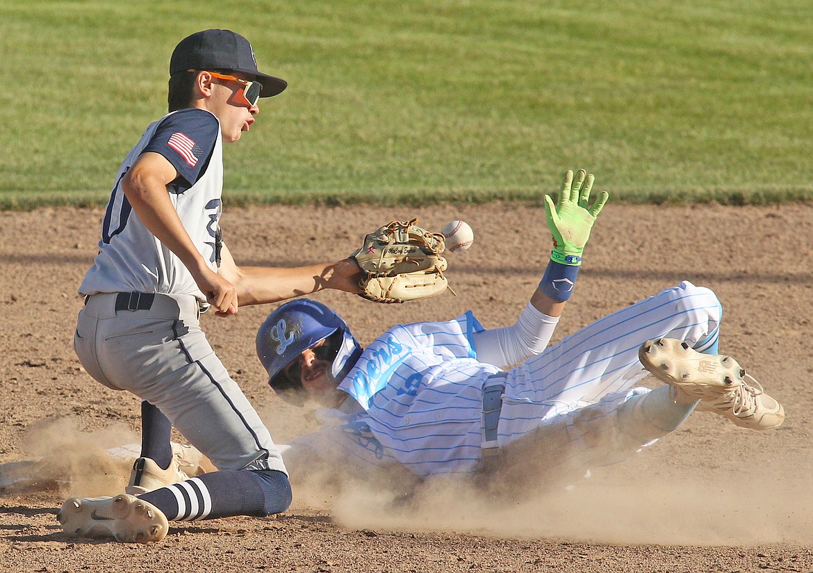 Libby's Aidan Rose steals safely under the throw to second baseman McCoy Endres in the bottom of the fourth with one out. The Loggers beat the Bitterroot Bucs 9-8 Wednesday at Lee Gehring Field. (Paul Sievers/The Western News)