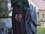 Howling wolf, owls sprout from old tree in Coeur d'Alene