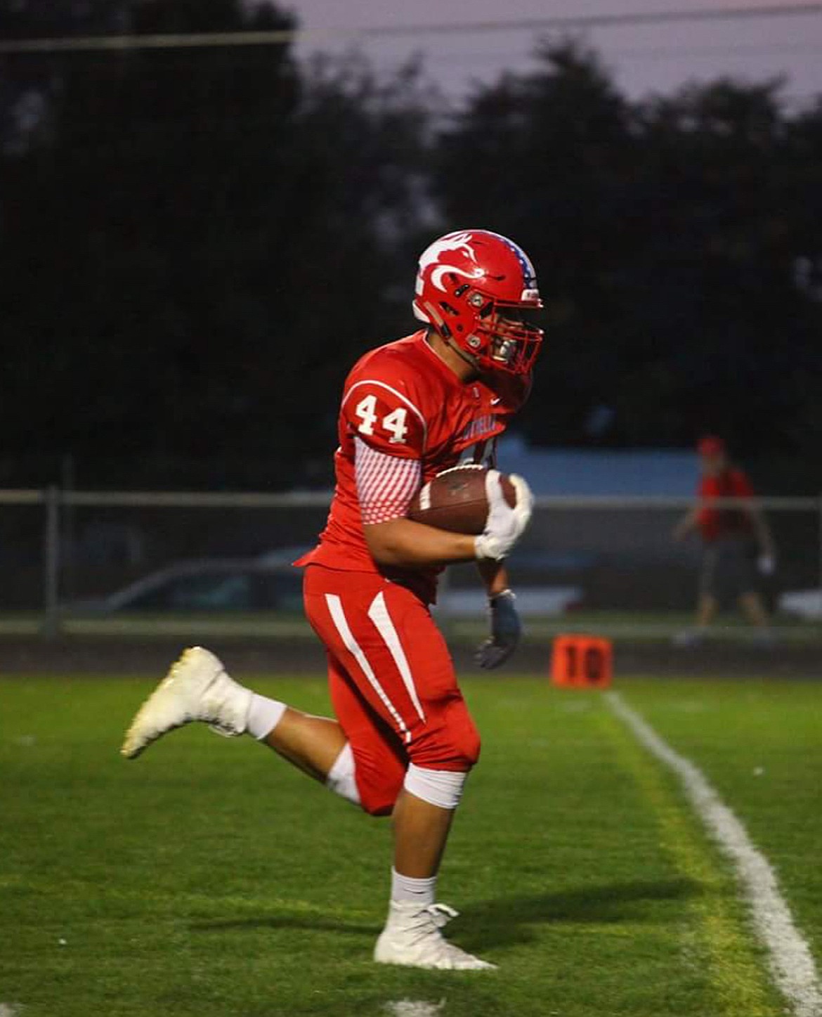 Isaiah Perez running up field in a game for the Huskies. Perez was a three-star recruit when he committed to BYU during his junior year at Othello.