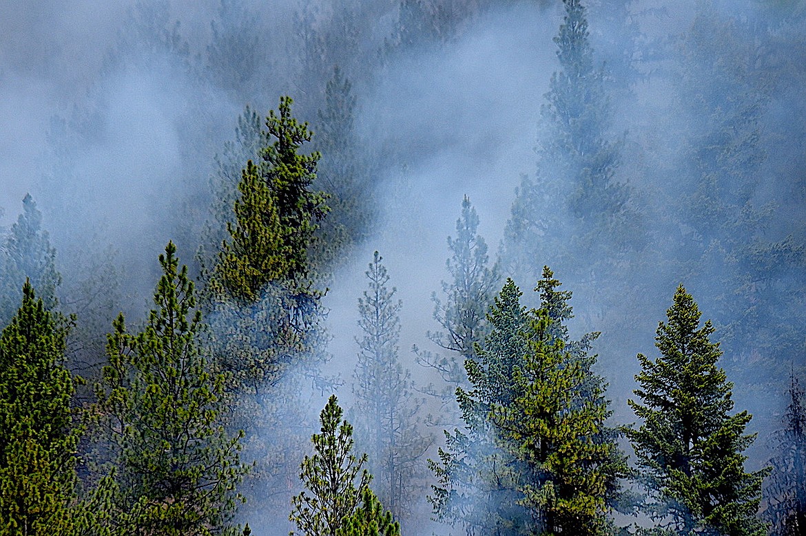 Heavy smoke comes off the smoldering Wolf Syrup Fire Thursday, June 19, 2025, in Lincoln County. (Scott Shindledecker/The Western News)