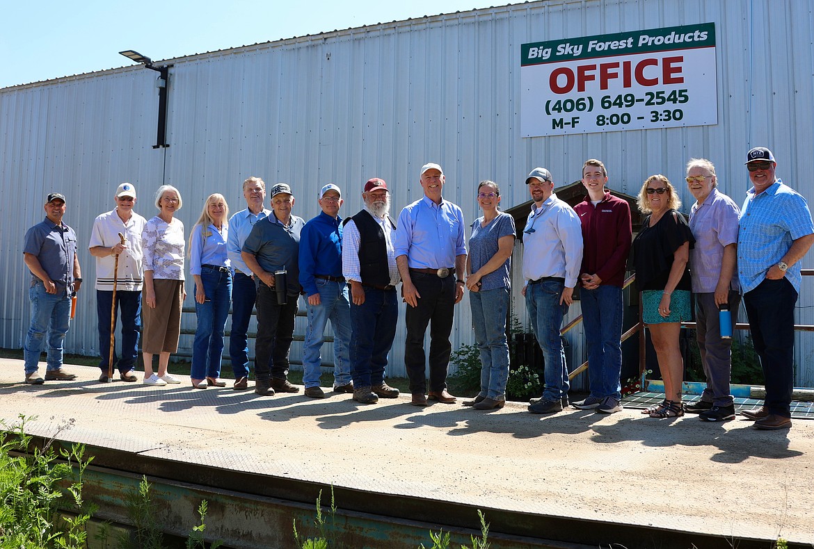 Angelo Ververis, Rob and Elaine Robinson, first lady Susan Gianforte, Rep. Curtis Cochran, Mineral County Commissioner Duane Simons, Marc Vasser, Sen. Denley Loge, Gov. Greg Gianforte, Liz Thompson, Andrew Hanson, Carter Jasper, Mary and Dennis Yarnell, and Al Dunlap were all on hand for the ceremonial signing of HB 79 last week in St. Regis. (Courtesy photo)