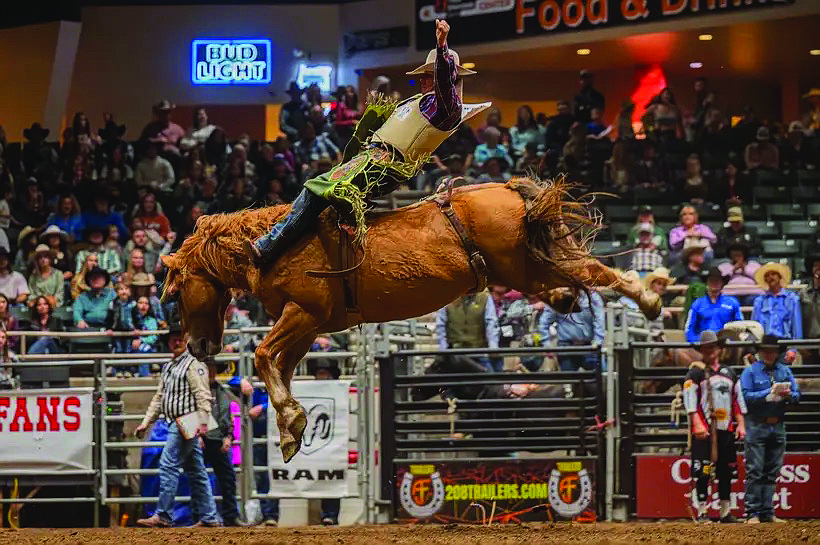Mason Payne catching air while riding at the rodeo. Payne said he grew up around the rodeo with his family and Grandpa Red showing him the ropes.