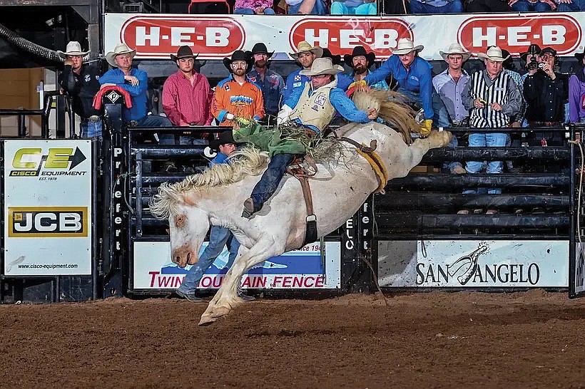 Mason Payne catching air while riding at the rodeo. Payne said he grew up around the rodeo with his family and Grandpa Red showing him the ropes.